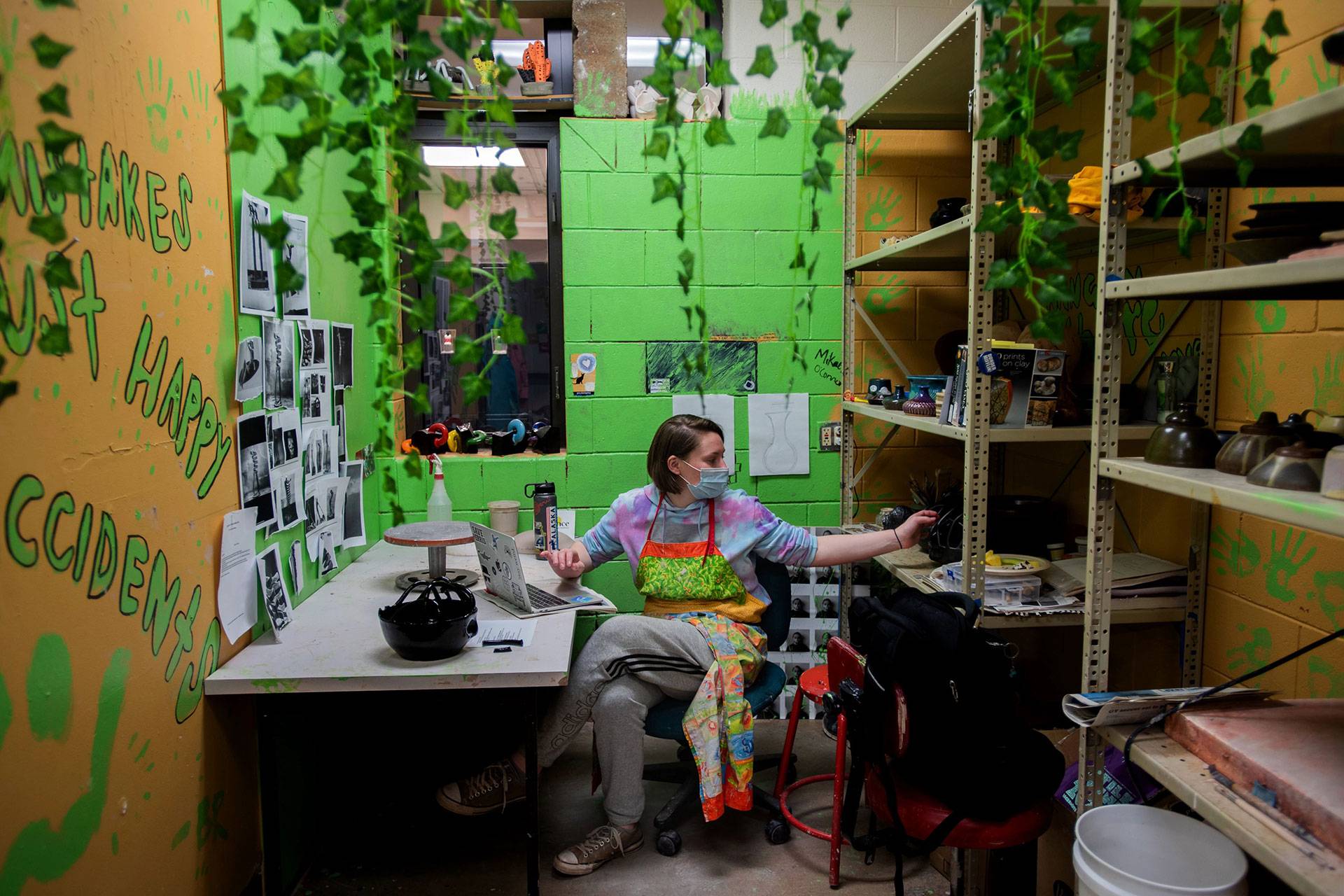 Ceramics Student sitting in their studio